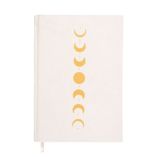 Notebook with gold moon phase design on a white background