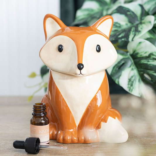 Fox-shaped container with a small bottle on a wooden surface
