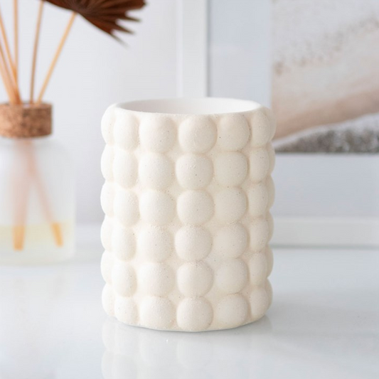 White textured vase on a light background